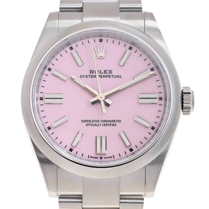 A stainless steel Rolex Oyster Perpetual wristwatch with a pink dial, silver hour markers, and a matching metal bracelet.